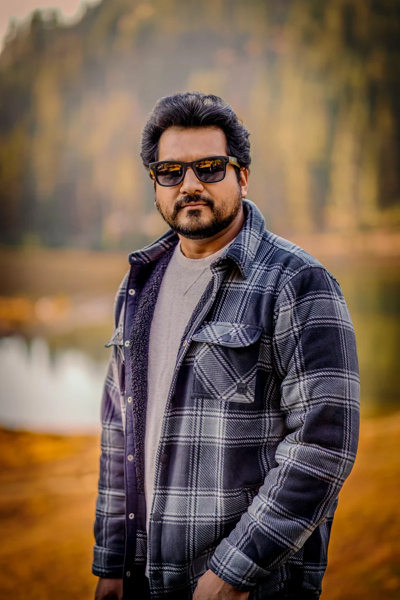 Azar Jindal wearing glasses outdoors