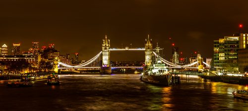 Tower Bridge and HMS Belfast at night, London, England